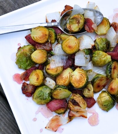 plate of roasted brussels sprouts with peppered bacon