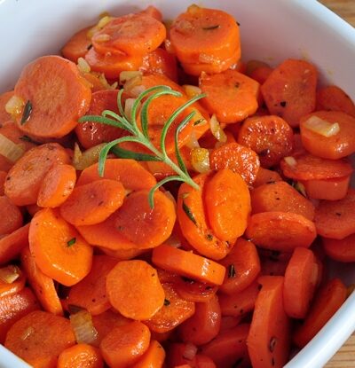 bowl of carrots with rosemary and thyme