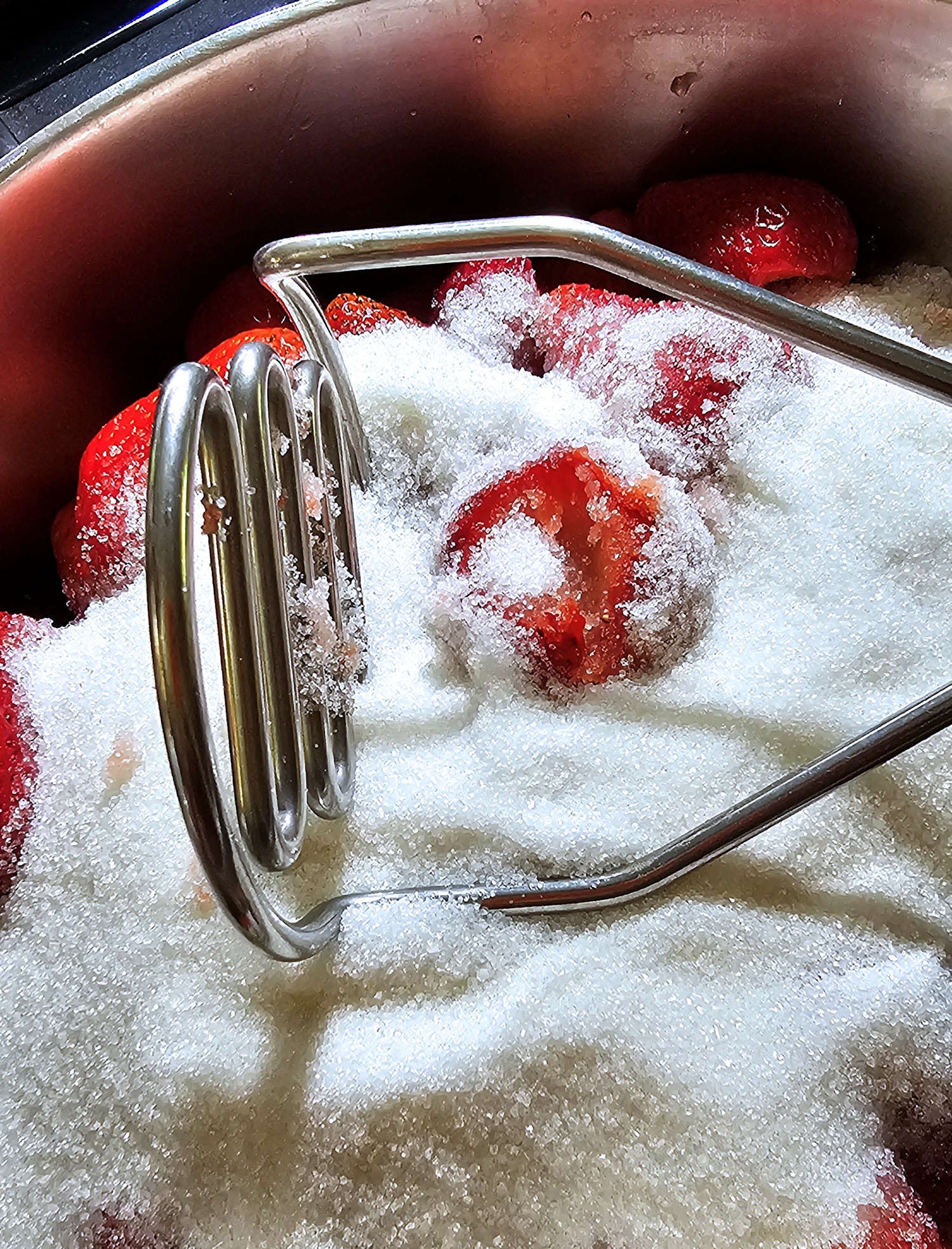 mashing the berries