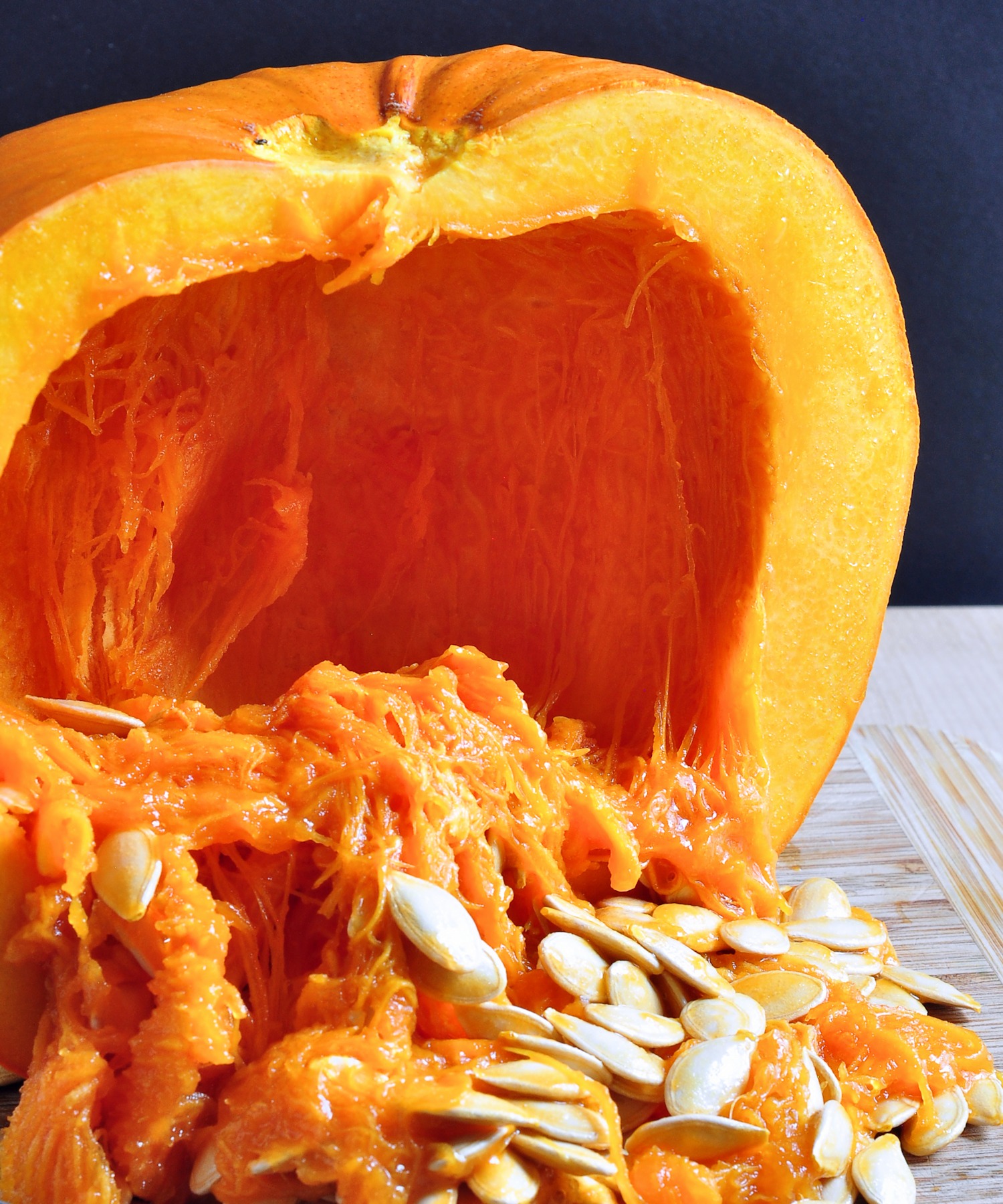 scooping out pumpkin seeds